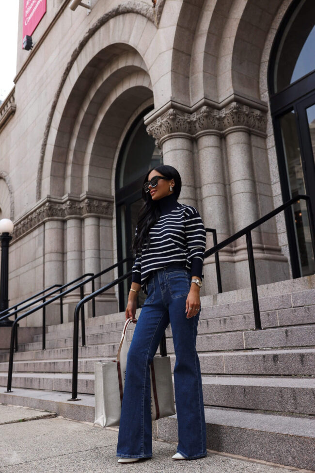 fashion blogger mia mia mine wearing a striped sweater and denim from walmart