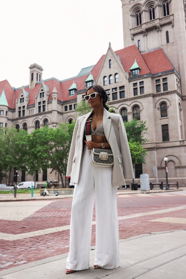 fashion blogger wearing white trousers from revolve