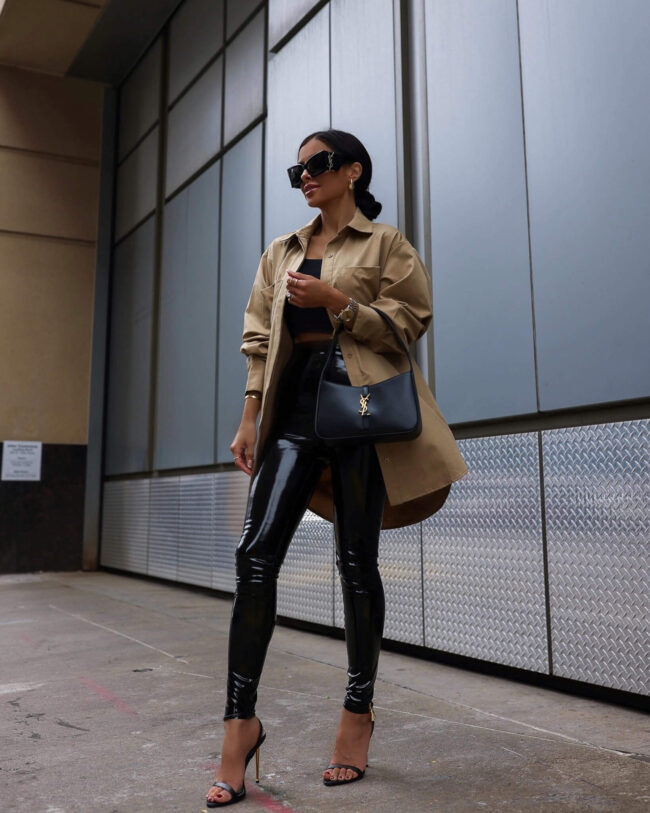 fashion blogger mia mia mine wearing an oversized khaki shirt and patent leather leggings from nordstrom