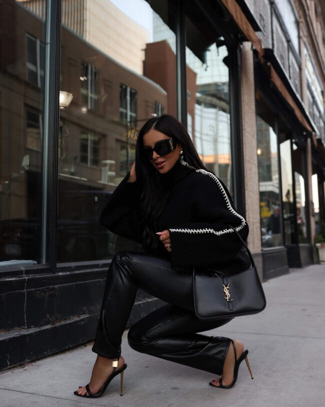 fashion blogger wearing agolde leather pants on sale at saks