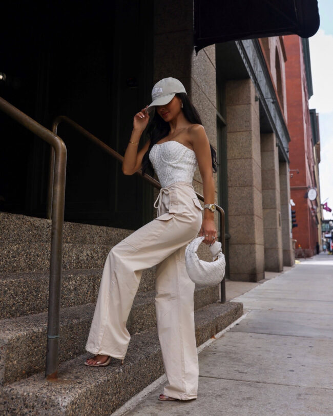 brunette fashion blogger wearing a cargo pants and a knit corset top