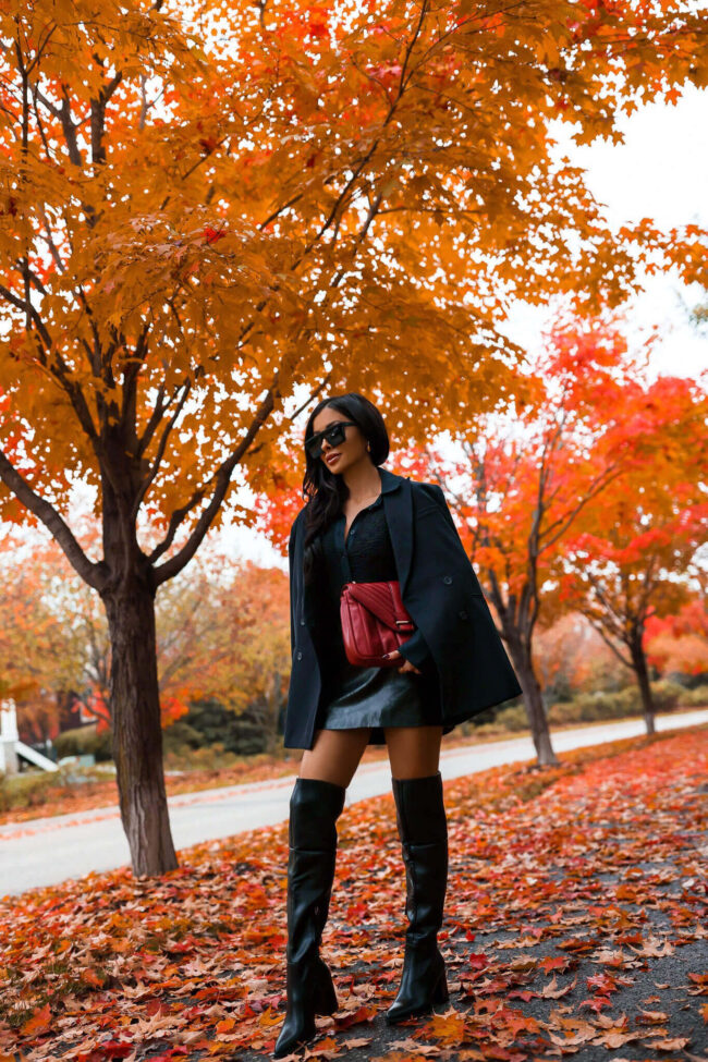 fashion influencer mia mia mine wearing a black outfit from walmart