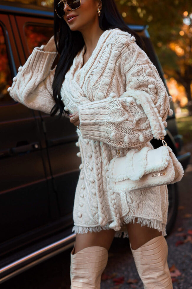 fashion blogger wearing a Jacquemus Le Petit Bambimou Doux Shearling Shoulder Bag