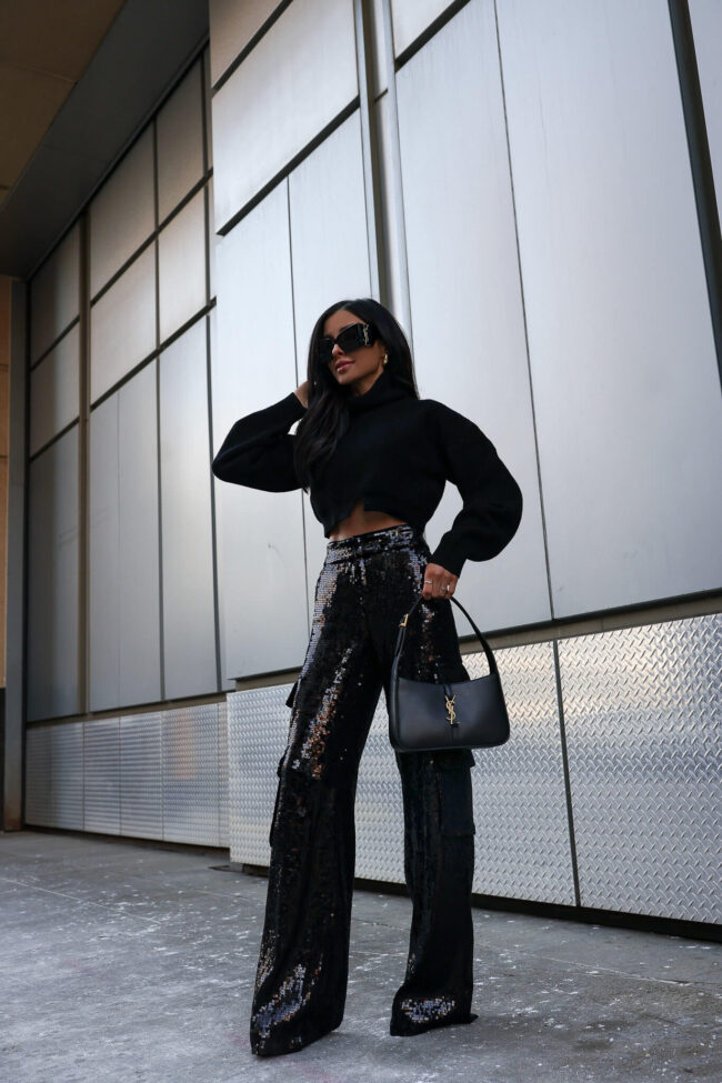 fashion blogger mia mia mine wearing sequin cargo pants and a crop sweater from saks