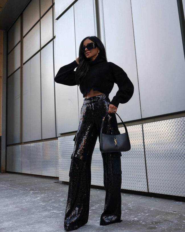 fashion blogger mia mia mine wearing sequin cargo pants and a crop sweater from saks