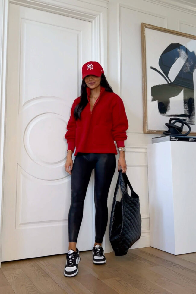 fashion blogger mia mia mine wearing a red fleece from Walmart