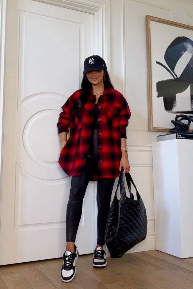 Fashion blogger mia mia mine wearing a red and black plaid shacket from Walmart