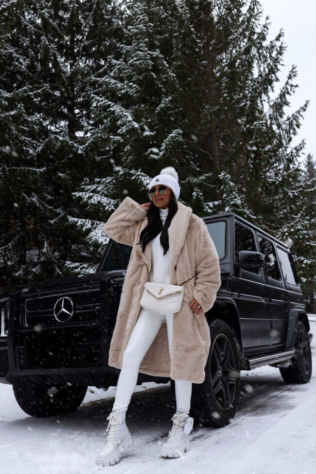 fashion blogger mia mia mine wearing a faux fur coat from abercrombie