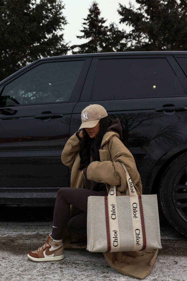 fashion blogger mia mia mine wearing a nike air jordan sneakers and a chloe woody tote from nordstrom