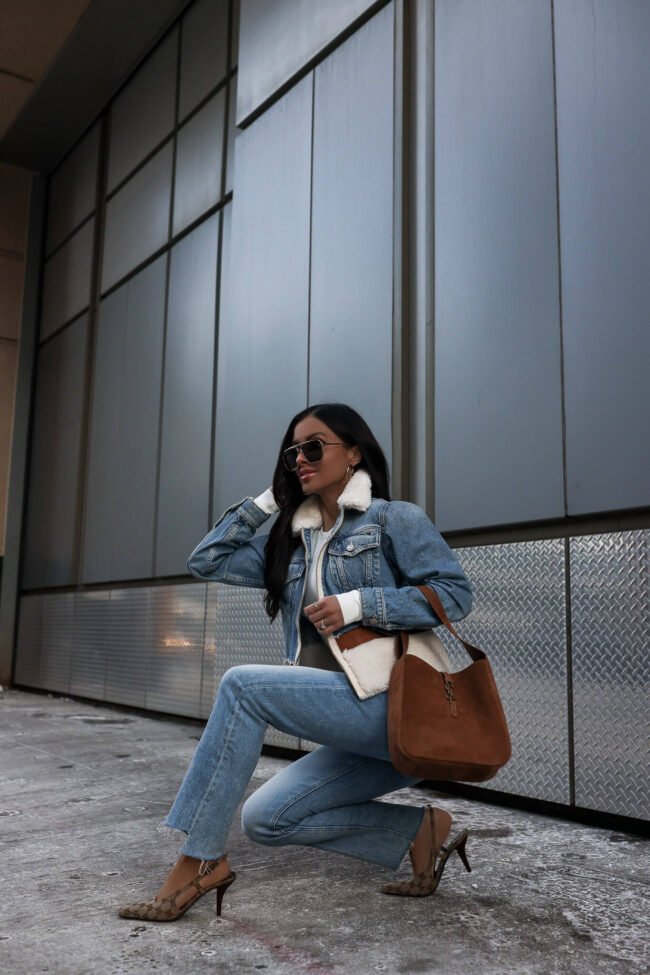 fashion blogger mia mia mine wearing mother denim and a mother denim shearling jacket from saks