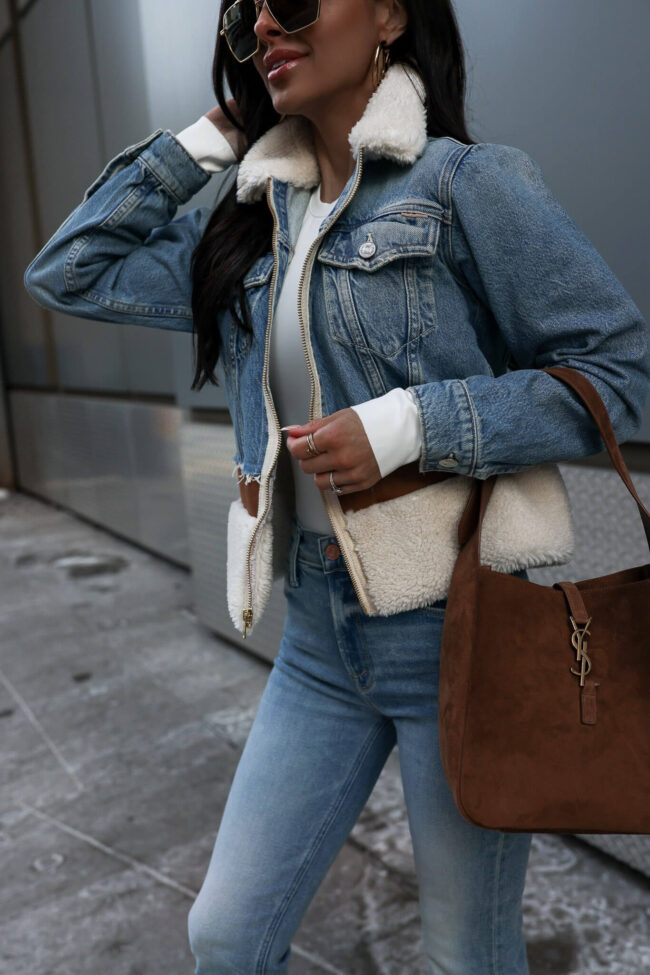 fashion blogger mia mia mine wearing a denim outfit from saks