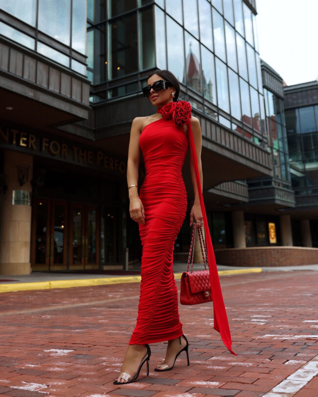 mia mia mine wearing a red wedding guest dress