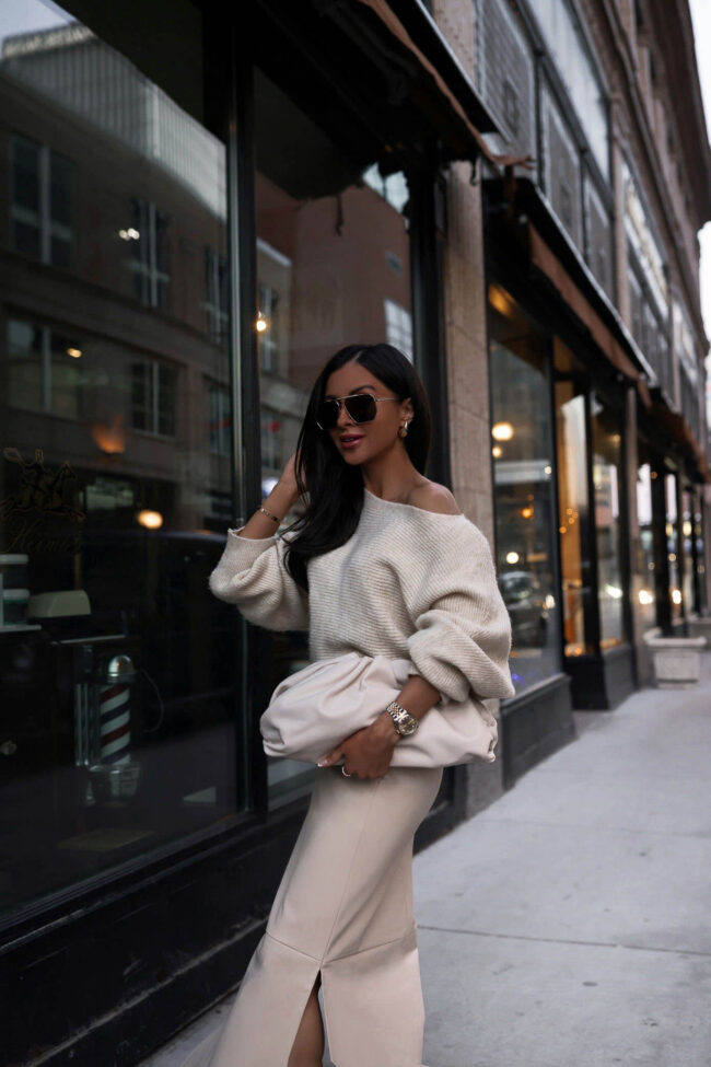 fashion blogger mia mia mine wearing an off the shoulder sweater from nordstrom and a faux leather long skirt