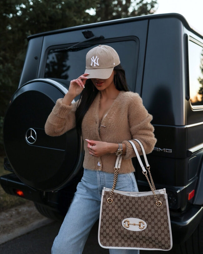 fashion blogger mia mia mine wearing a valentine's day sweater