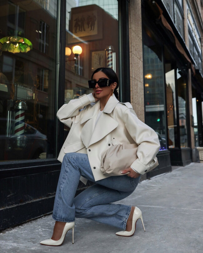 fashion blogger wearing a white faux leather jacket