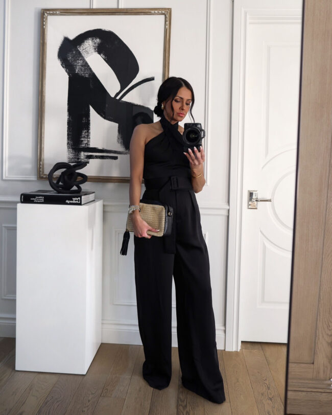 fashion blogger wearing  a black jumpsuit from walmart