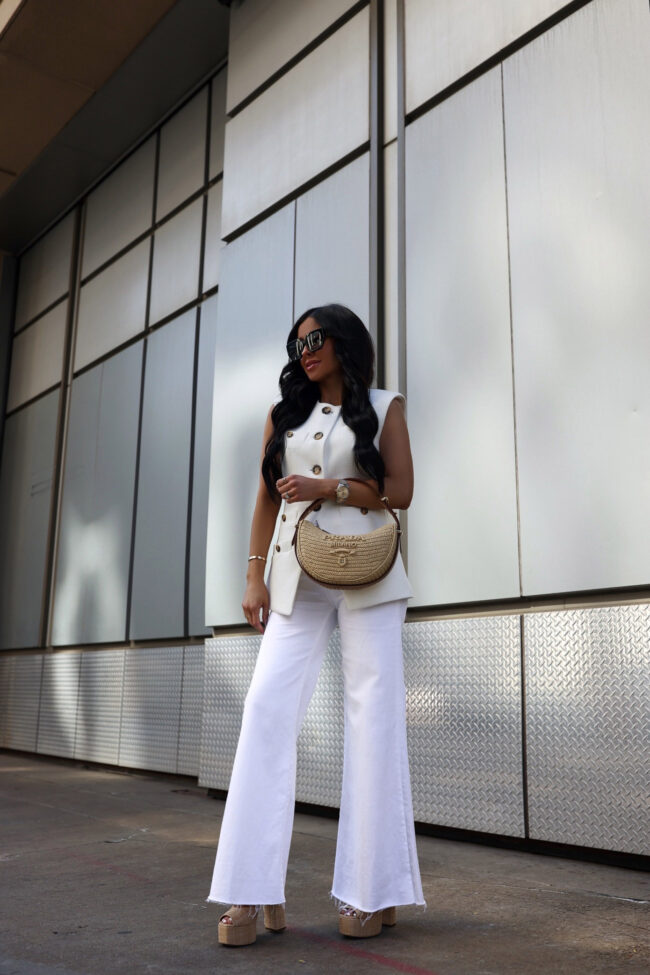 fashion blogger wearing an all white spring outfit from saks fifth avenue