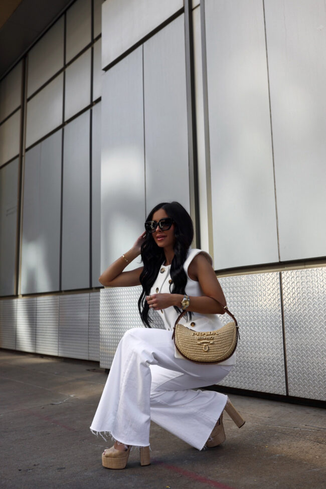 mia mia mine wearing a white vest and white jeans from saks