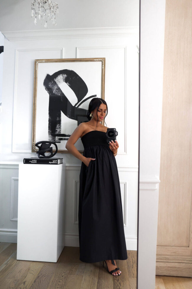 fashion blogger mia mia mine wearing a black linen dress from walmart