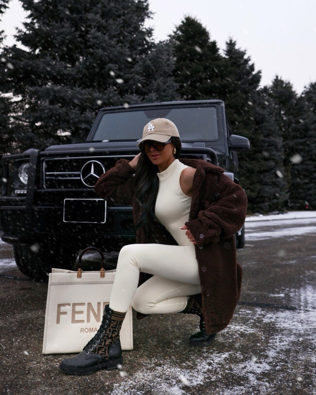 mia mia mine wearing a casual snow outfit