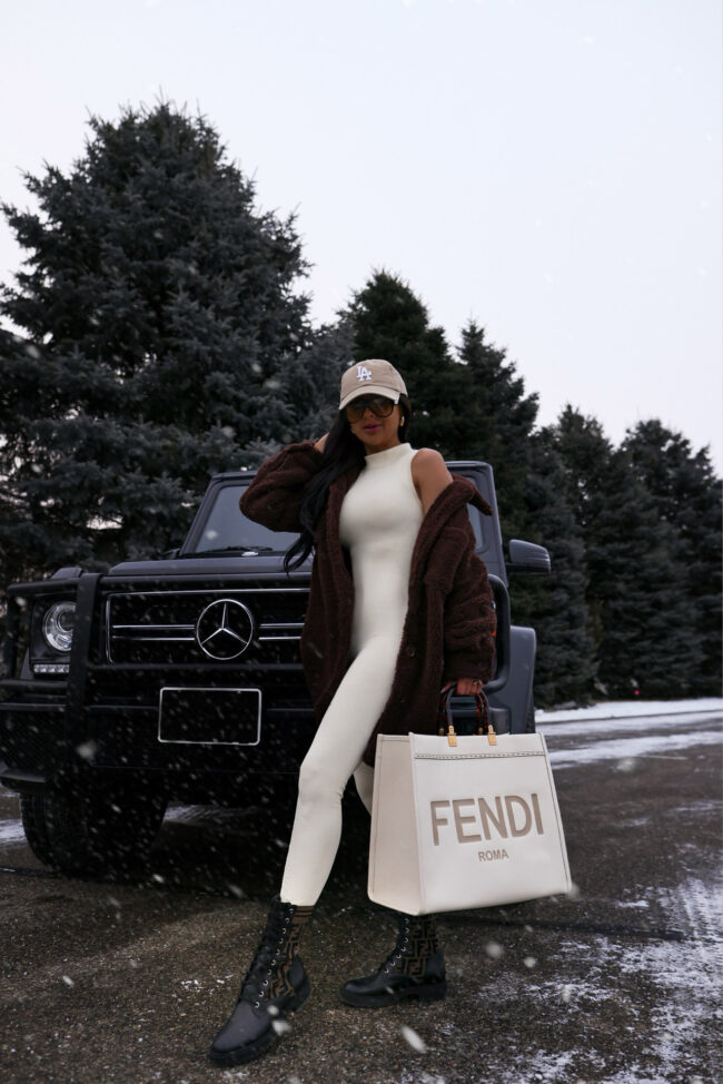 mia mia mine wearing a brown sherpa shacket from nordstrom