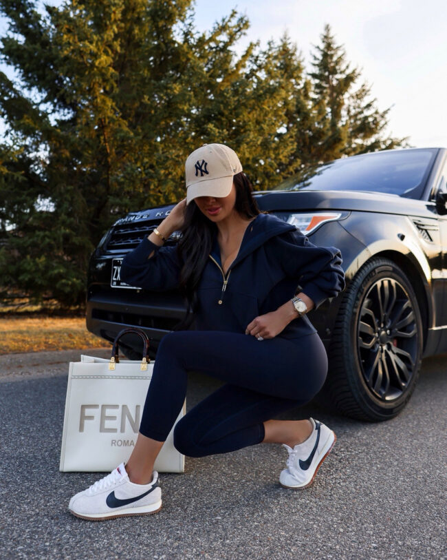 fashion blogger wearing nike cortez boucle sneakers