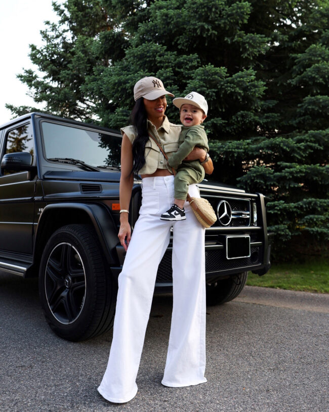 mia mia mine wearing white wide leg jeans from saks