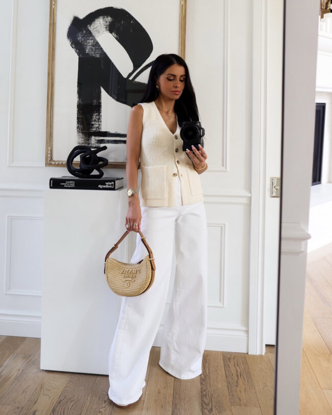 brunette fashion blogger wearing a sweater vest from saks