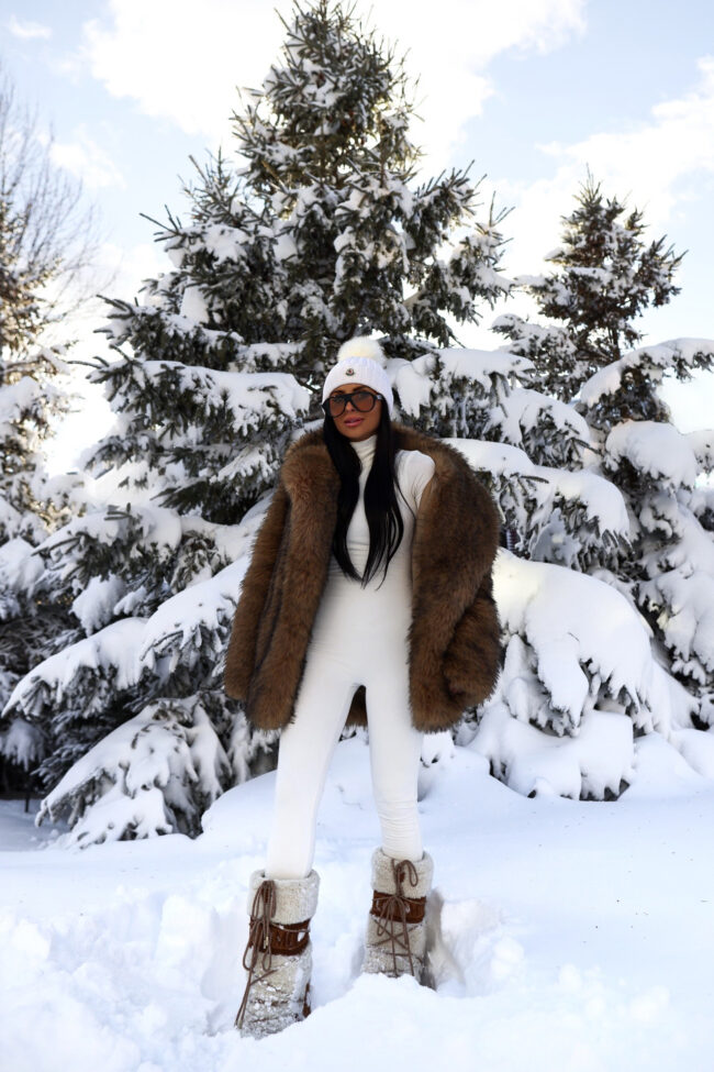 brunette fashion blogger wearing shearling moon boots for winter