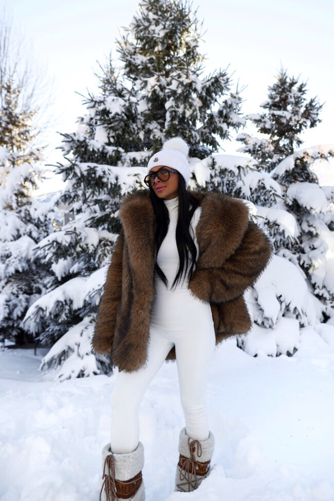 brunette fashion blogger wearing a brown faux fur coat from revolve