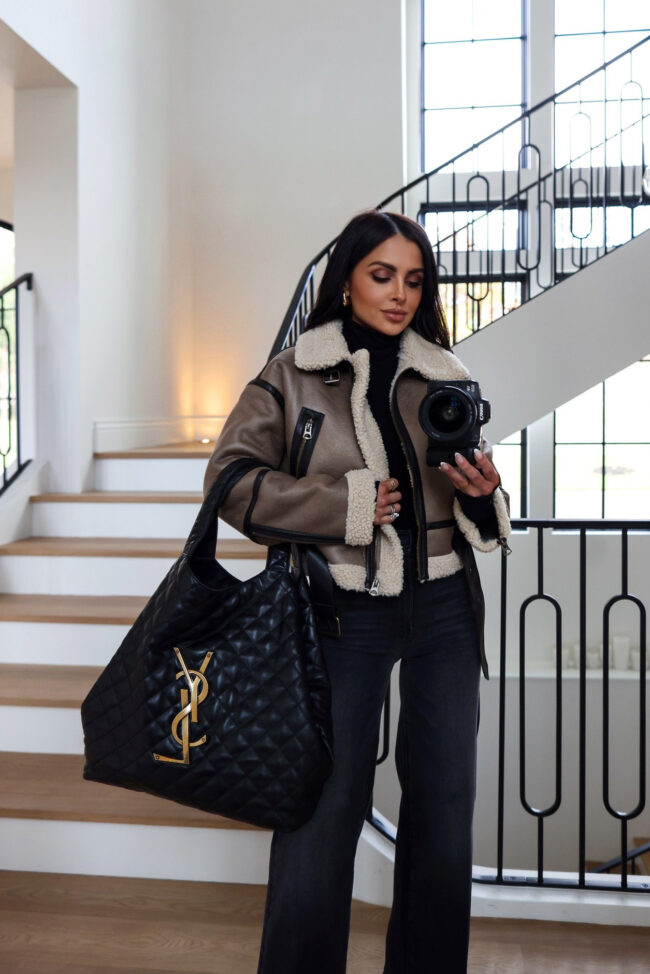 brunette fashion blogger wearing a zara faux shearling moto jacket