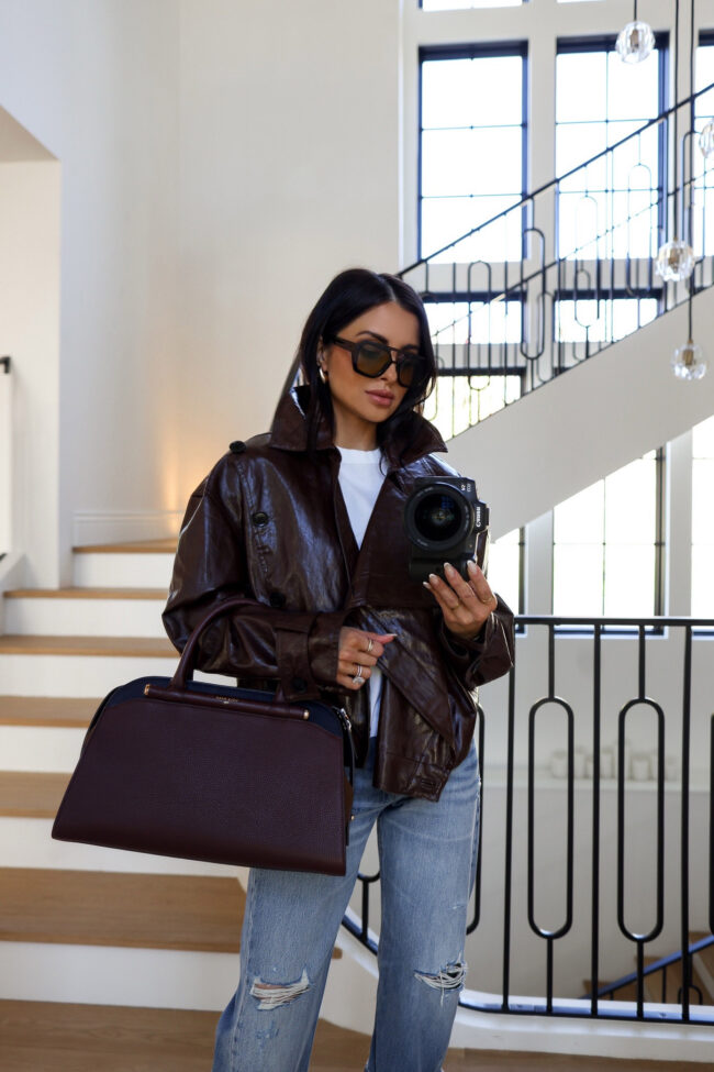 mia mia mine wearing a cole haan chocolate brown handbag from nordstrom