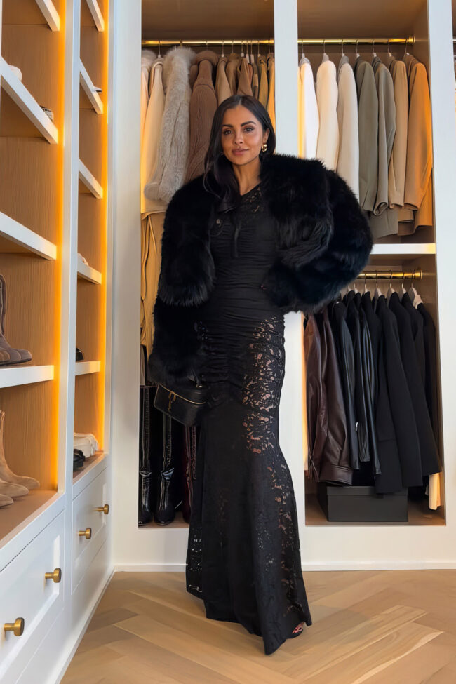 mia mia mine wearing a lace maxi dress and faux fur coat for the holidays