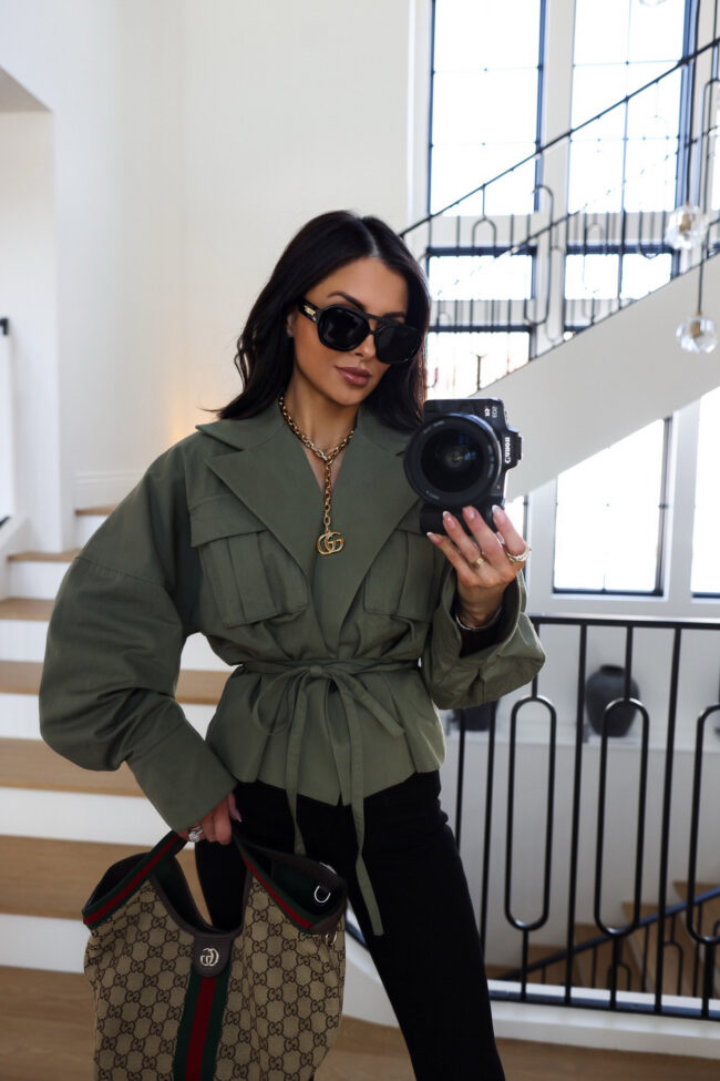 brunette fashion blogger wearing a cropped jacket from revolve