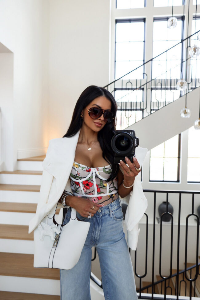 mia mia mine wearing a sheer floral bodysuit from anthropologie