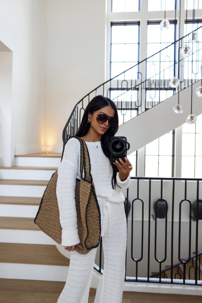 mia mia mine wearing an oversized beach bag from target