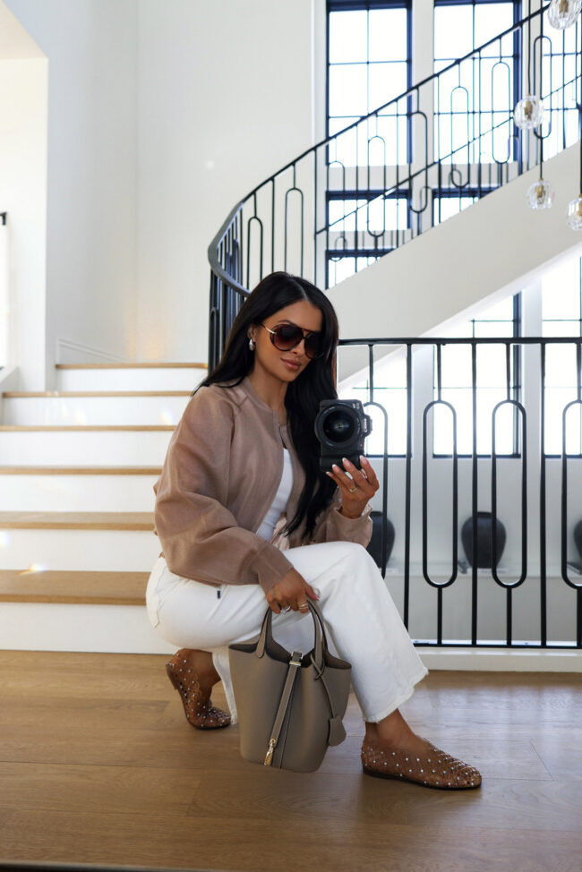 fashion blogger mia mia mine wearing a beige bomber jacket from zara