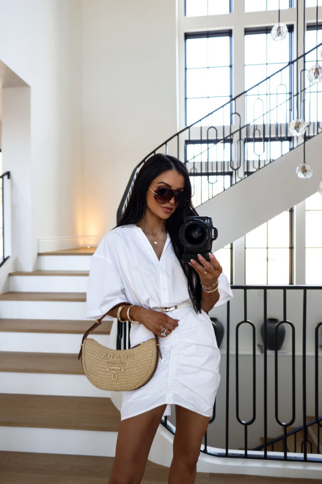 brunette fashion blogger wearing a white shirt dress from target