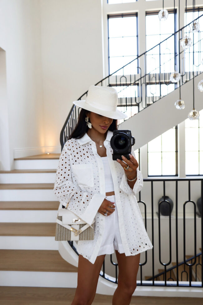 mia mia mine wearing a white eyelet shirt from amazon with target linen shorts