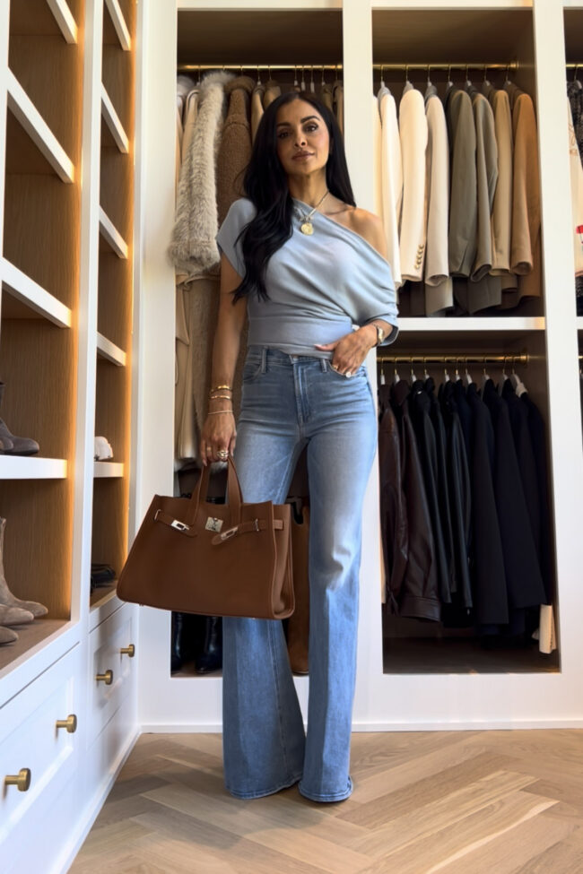 mia mia mine wearing a light blue off the shoulder top from reformation