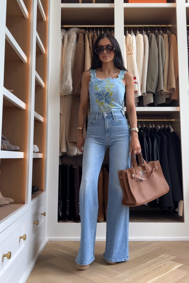 mia mia mine wearing the viral mother jeans with a farm rio top