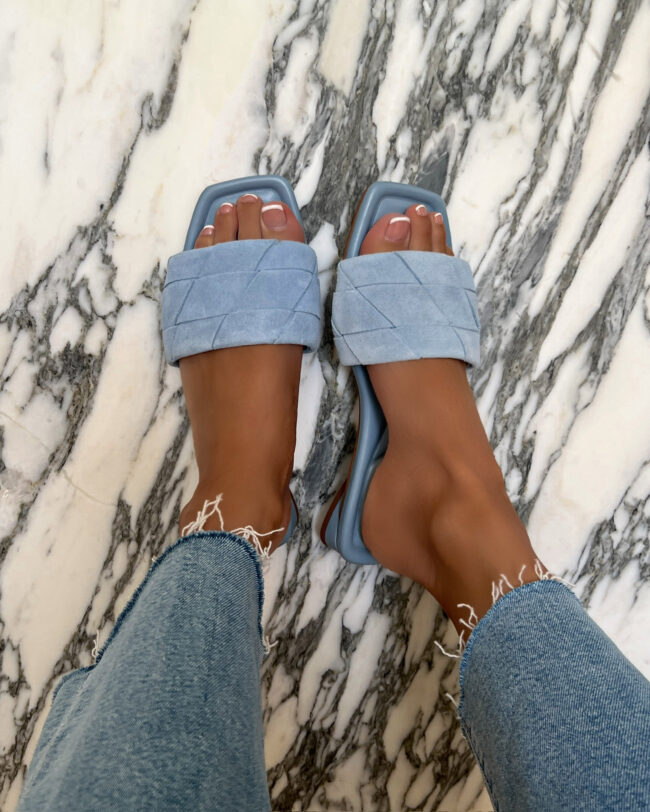 mia mia mine wearing light blue suede slides from nordstrom