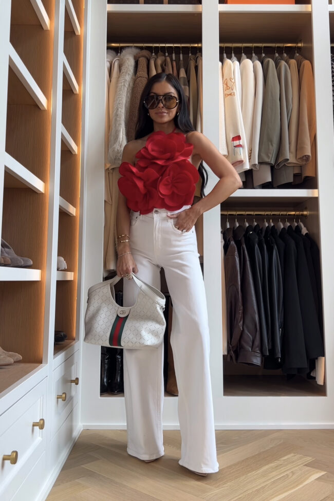 fashion blogger wearing a red 3d floral top from amazon