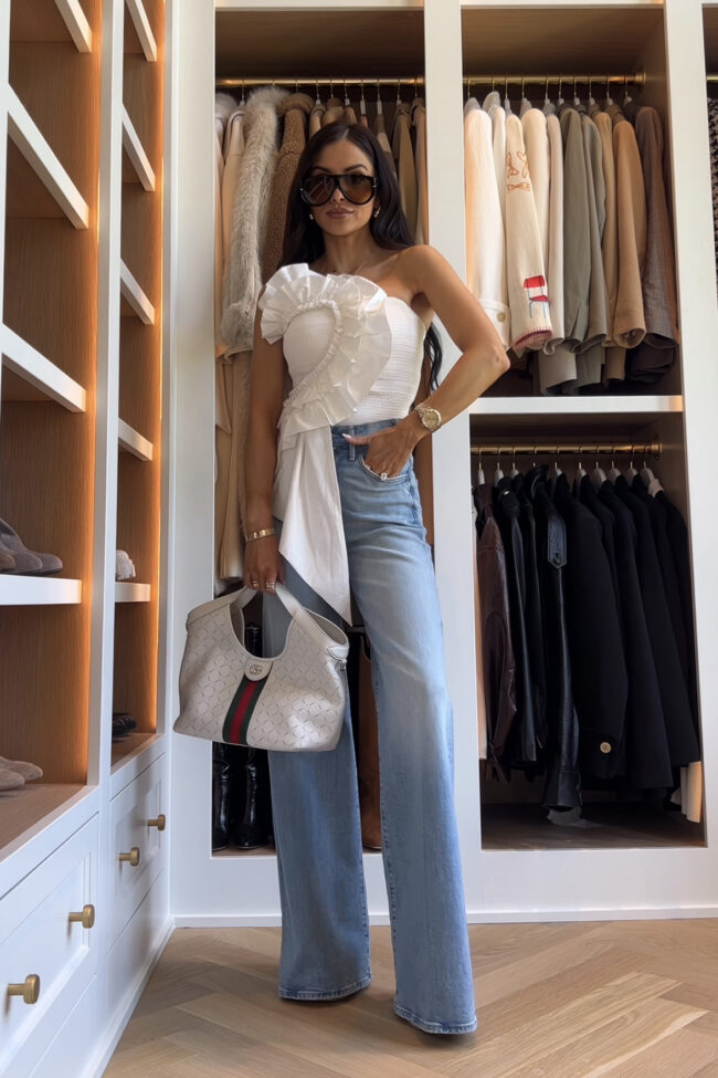mia mia mine wearing a farm rio statement top with mother hustler jeans