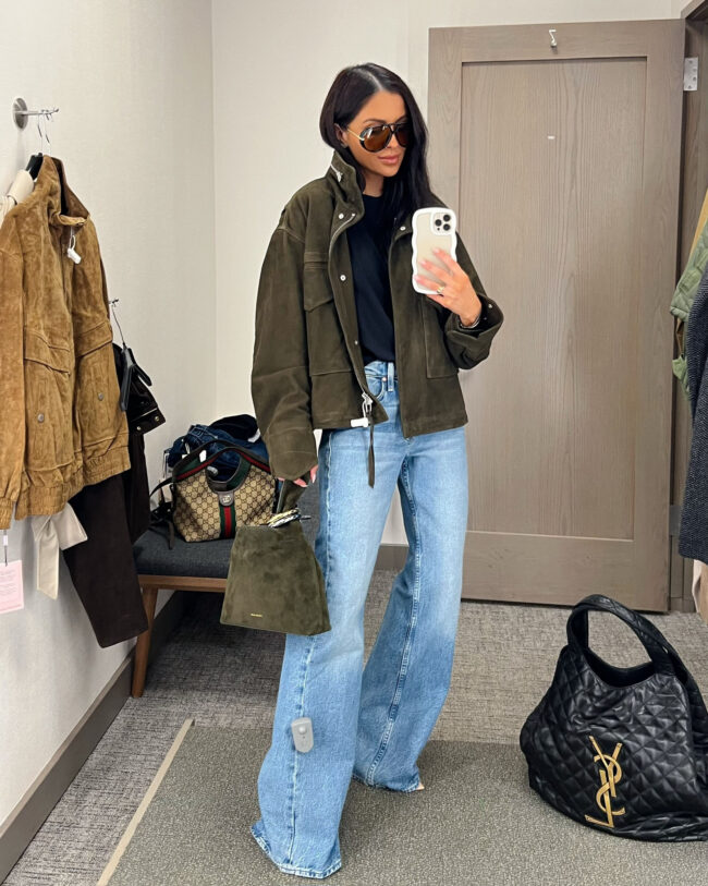 mia mia mine wearing an allsaints green jacket with mother bookie jeans from the nordstrom anniversary sale