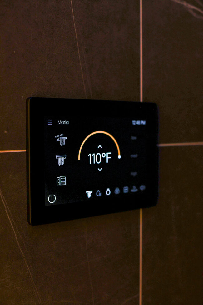 ThermaSol steam shower touchscreen control in a luxury home spa bathroom