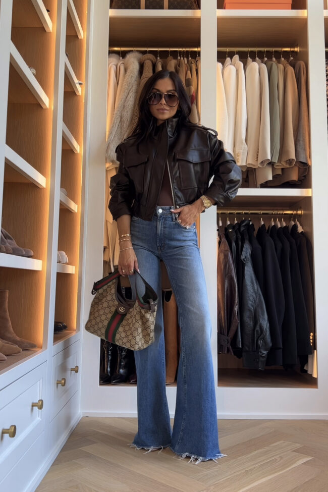 brunette fashion blogger wearing a cropped faux leather bomber jacket from amazon