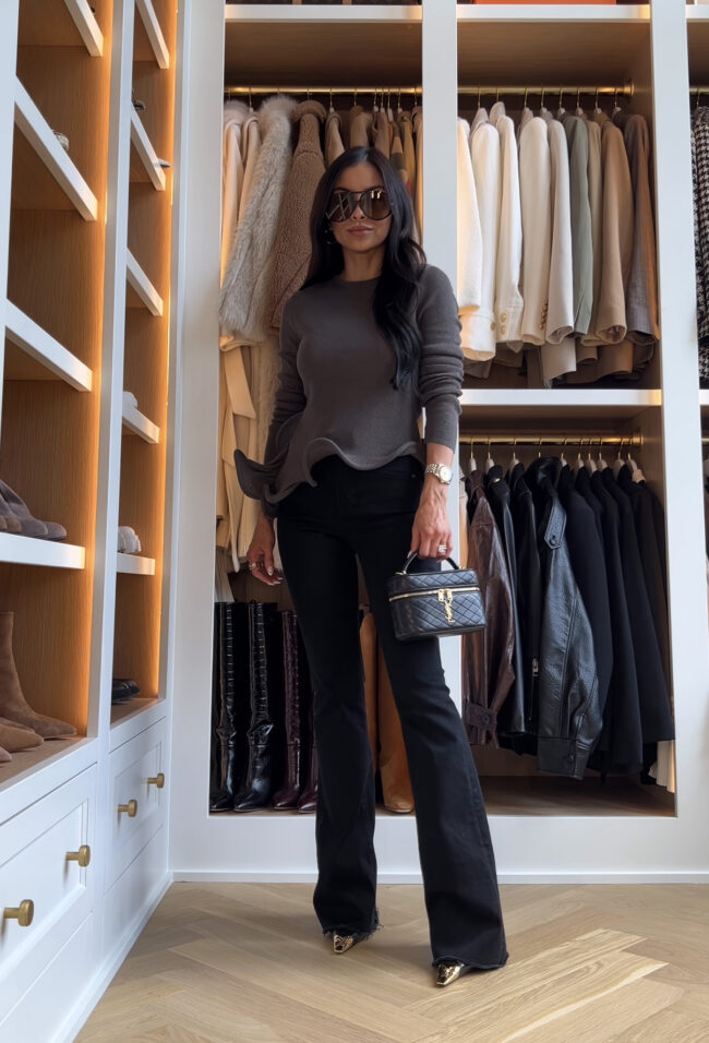 fashion blogger wearing a ruffle hem sweater from zara